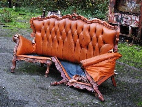 Front view of a skip on a residential street in Sutton